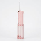 Pink dental water flosser on a white background