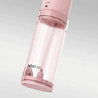 Pink h2ofloss device on a light gray background