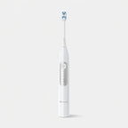 White electric toothbrush with blue bristles on a light gray background